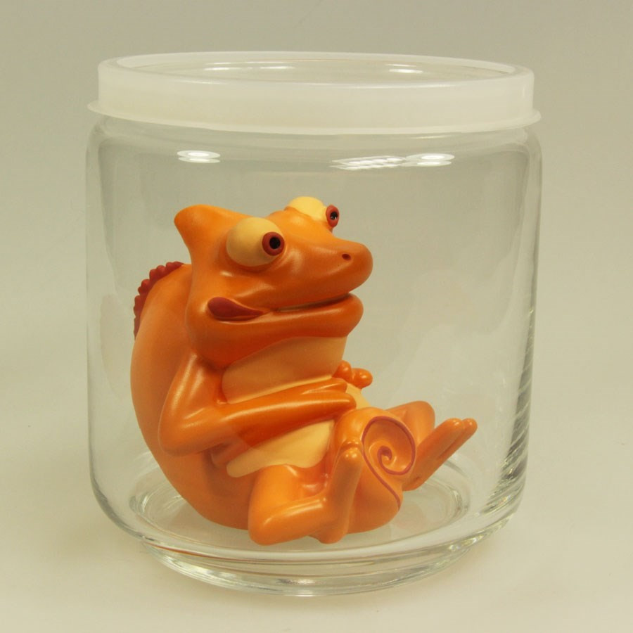 Bocal en verre avec monstre orange caché Bocal en verre avec monstre orange caché